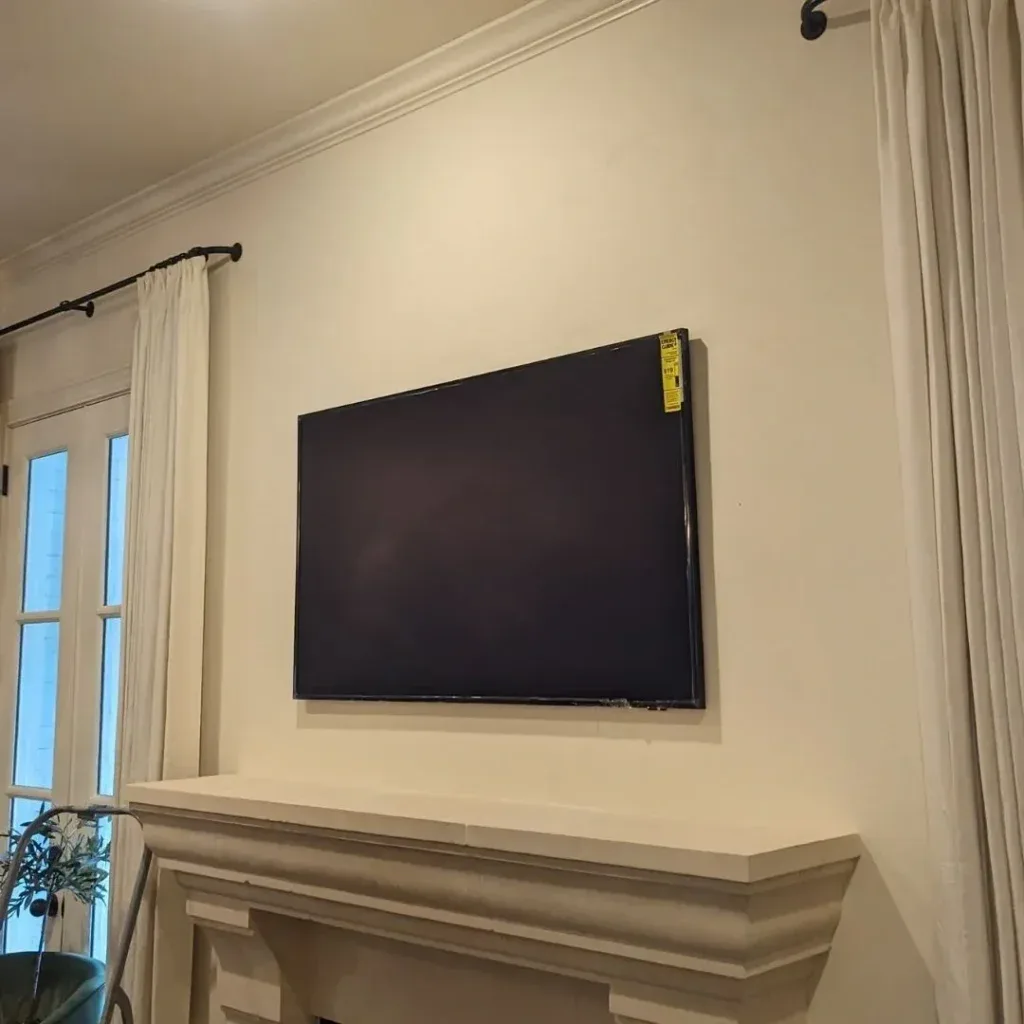TV mounted on a living-room wall