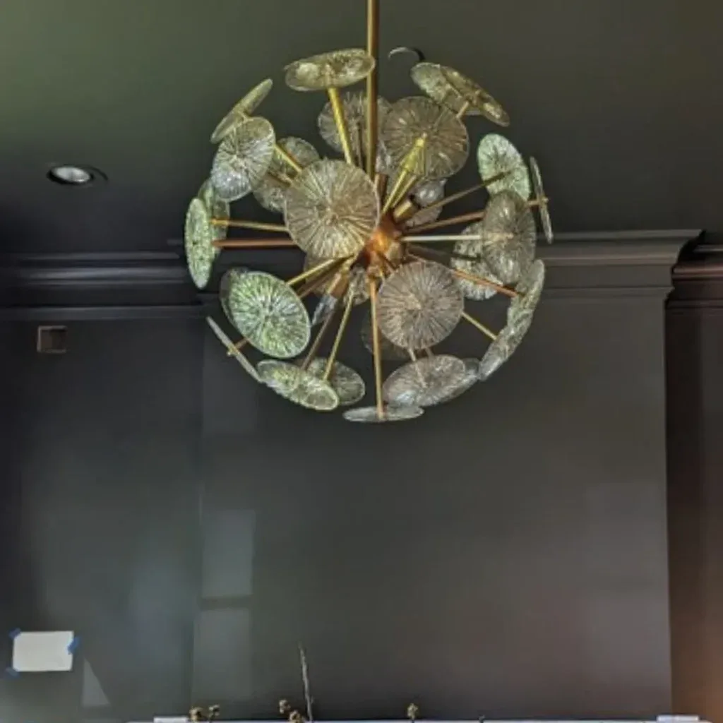 Sputnik fixture in a dark-ceilinged room