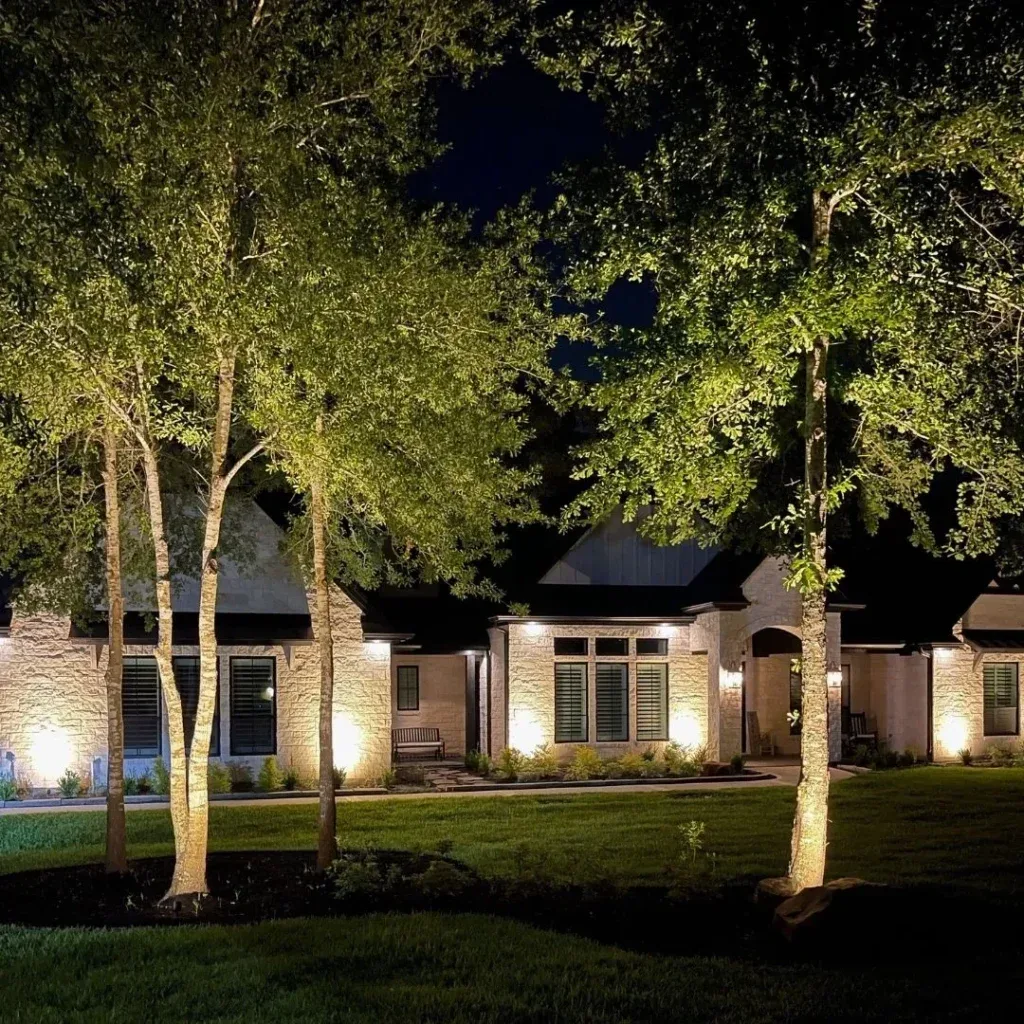 Uplighting on a stone home at night
