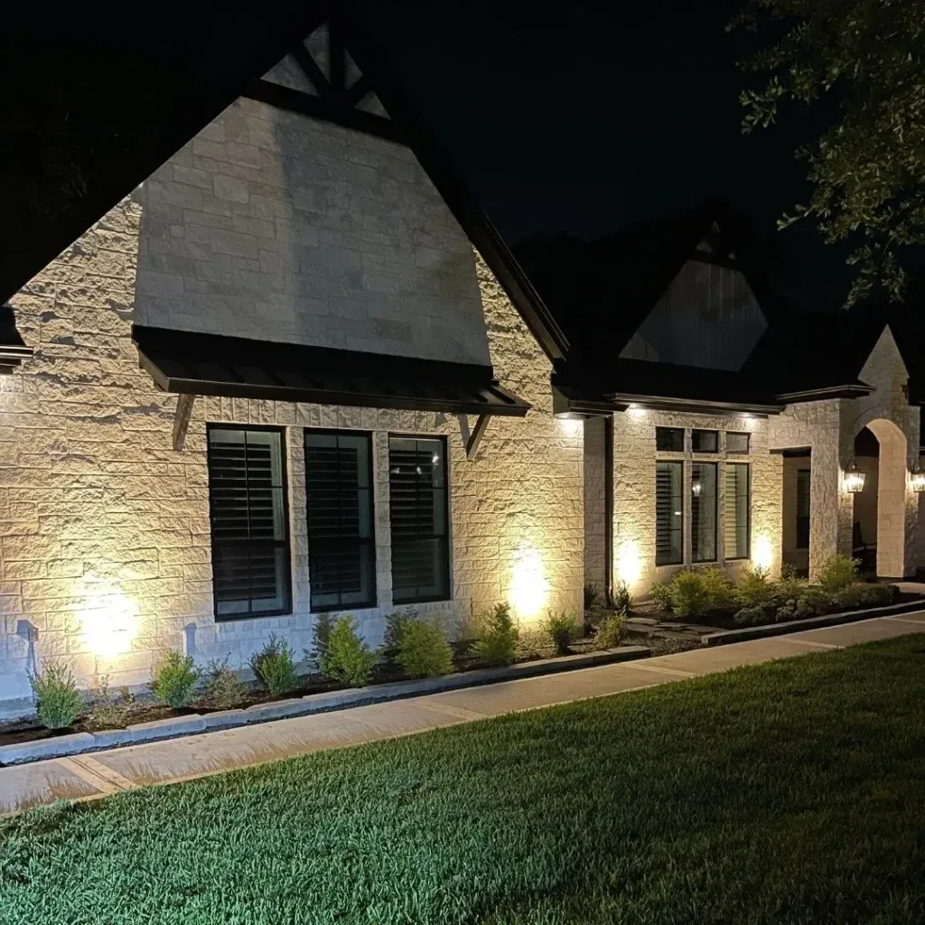 Front of a home lit at night