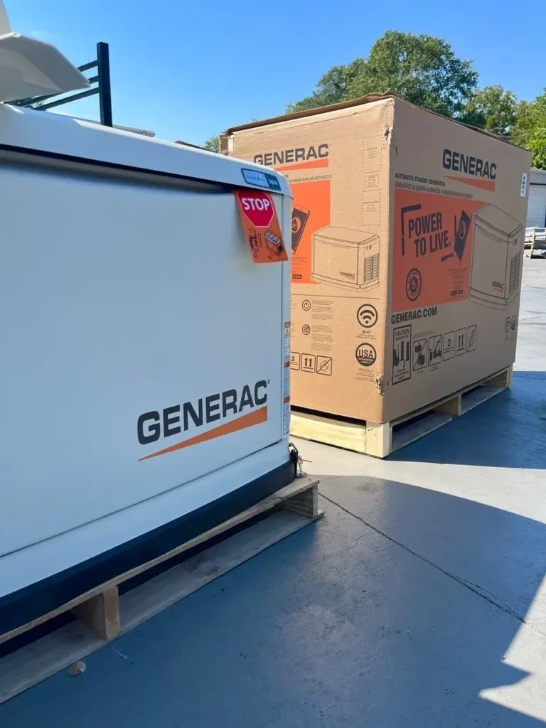 Generac standby generator on a pallet next to a boxed Generac unit