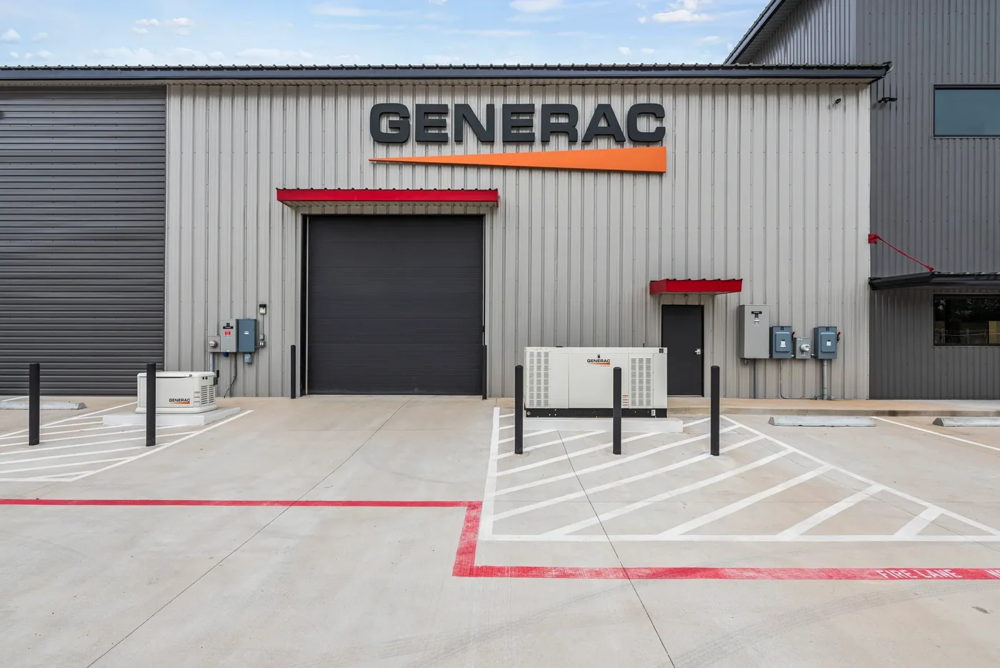 Generac-branded generator bay with standby generators displayed outside